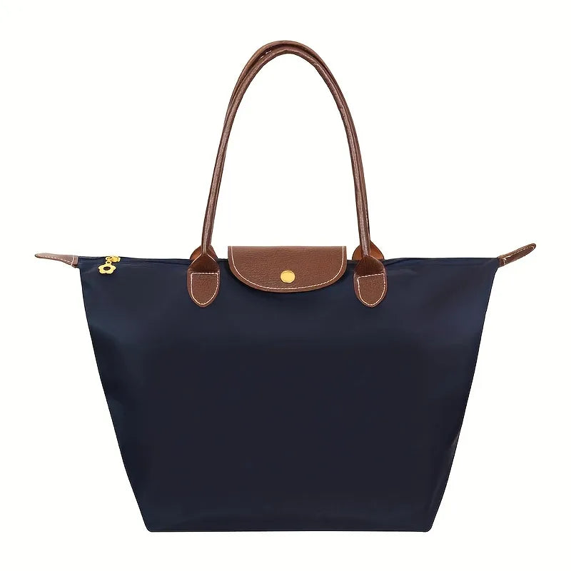 Womens daily shoulder handbag worn over the shoulder showcasing its practical size