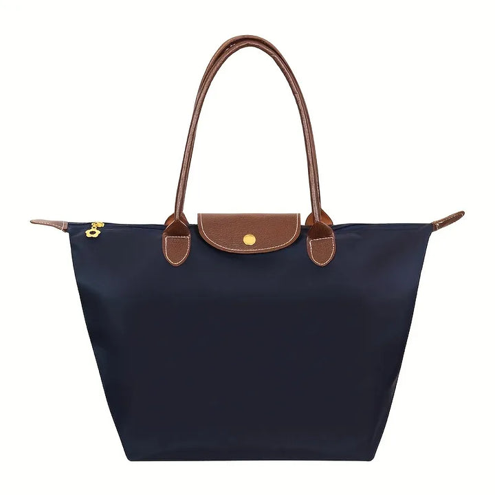 Womens daily shoulder handbag worn over the shoulder showcasing its practical size