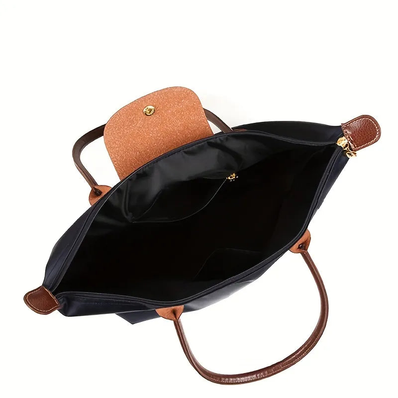 Interior view of women's shoulder handbag showing main compartment and pockets