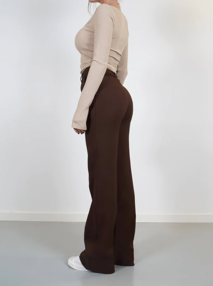 Back view of stylish high waist pants designed for modern women