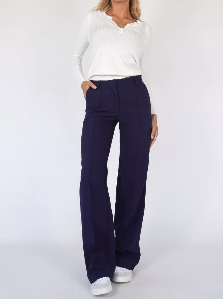 Detailed shot of pleating on chic wide leg pants for women