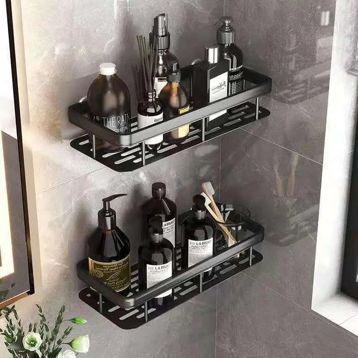 Black bathroom shelf holding skincare bottles and accessories