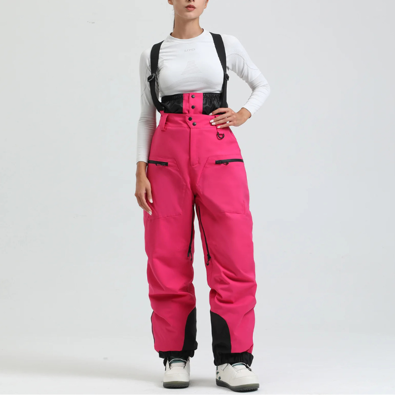 Side view of women's ski pants featuring secure pockets and winter gear details