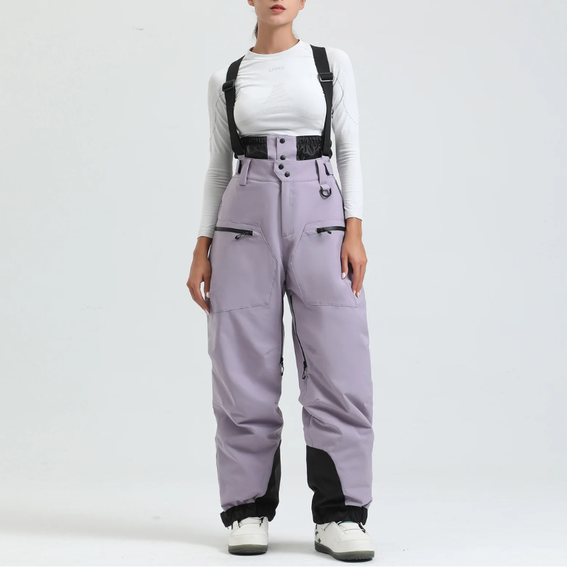Detailed shot of reinforced cuffs on women's braces pants for ski boots