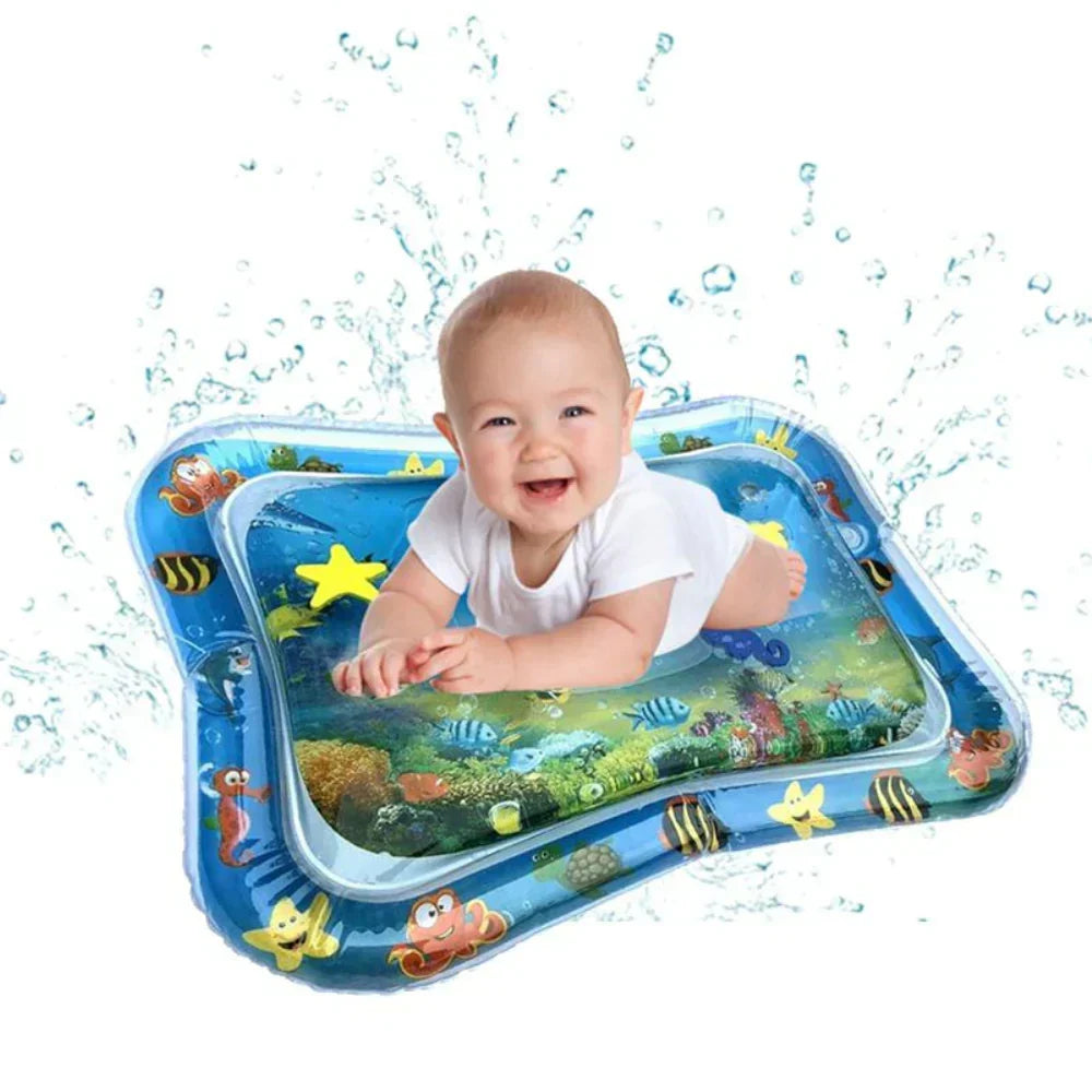 Happy baby doing tummy time on an inflatable water play mat with sea creatures
