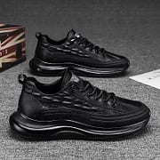 Top-down view of black lace-up casual footwear and sneakers