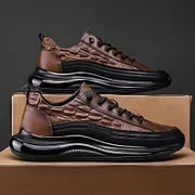 Top-down view of brown lace-up walking shoes and trainers