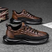 Pair of black mens luxury air cushion trainers side by side