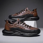 Pair of brown mens luxury air cushion trainers displayed together