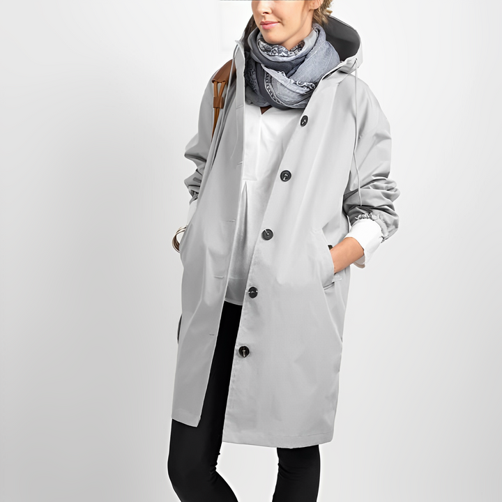 Womens hooded rain jacket folded compactly for easy travel and packing