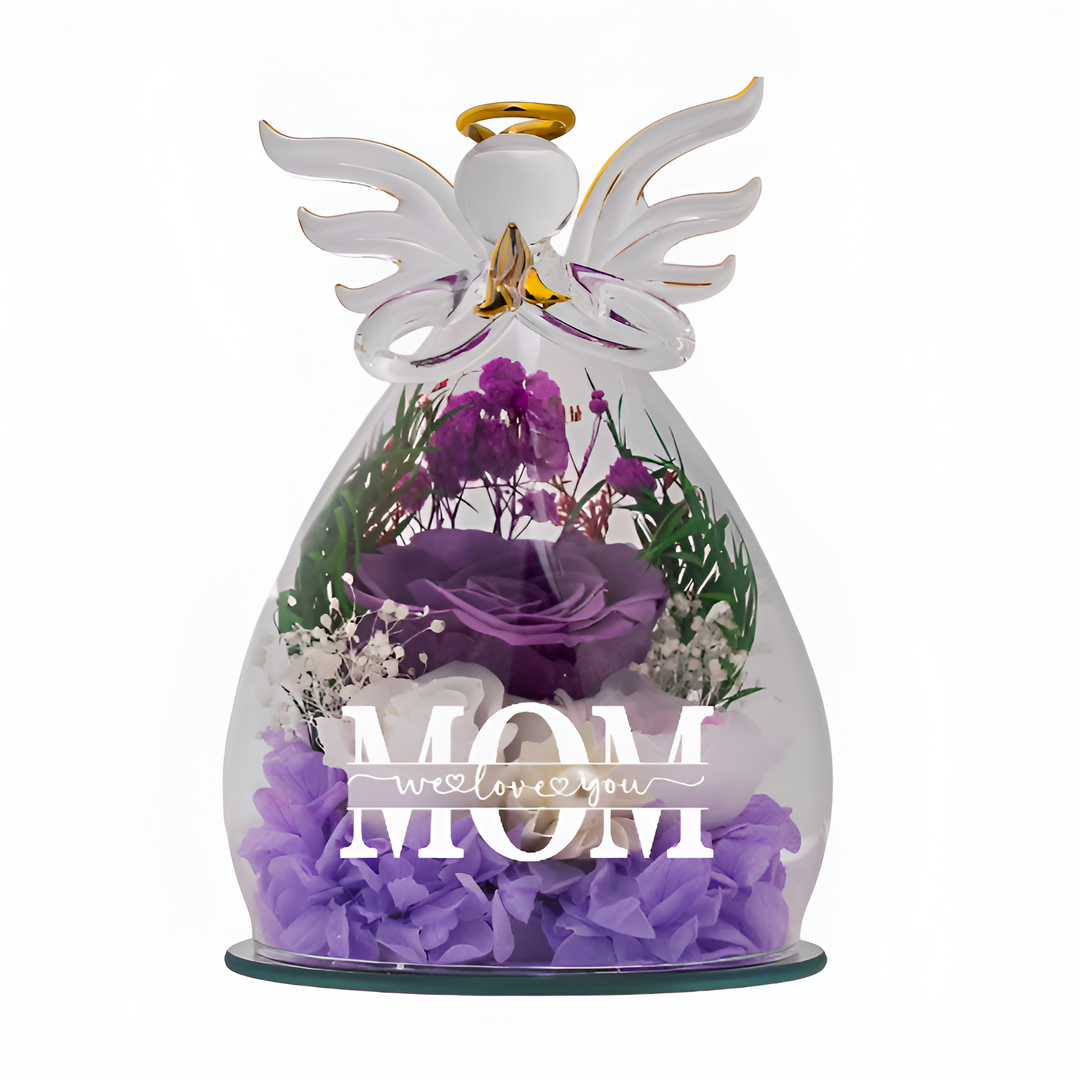 Lit glass angel with preserved flower showcased in a dark setting for glowing effect