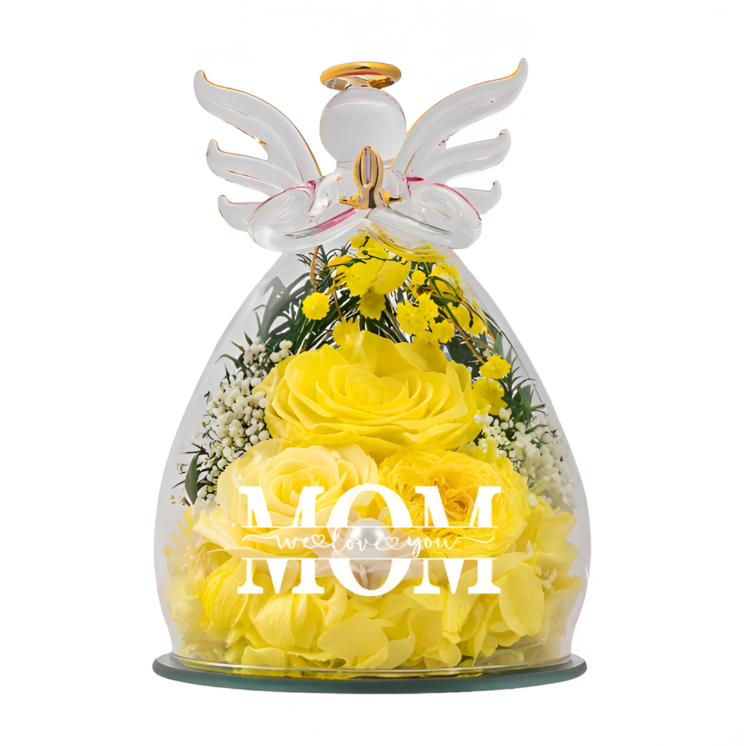 Gift box packaging next to the glowing glass angel flower sculpture for mom