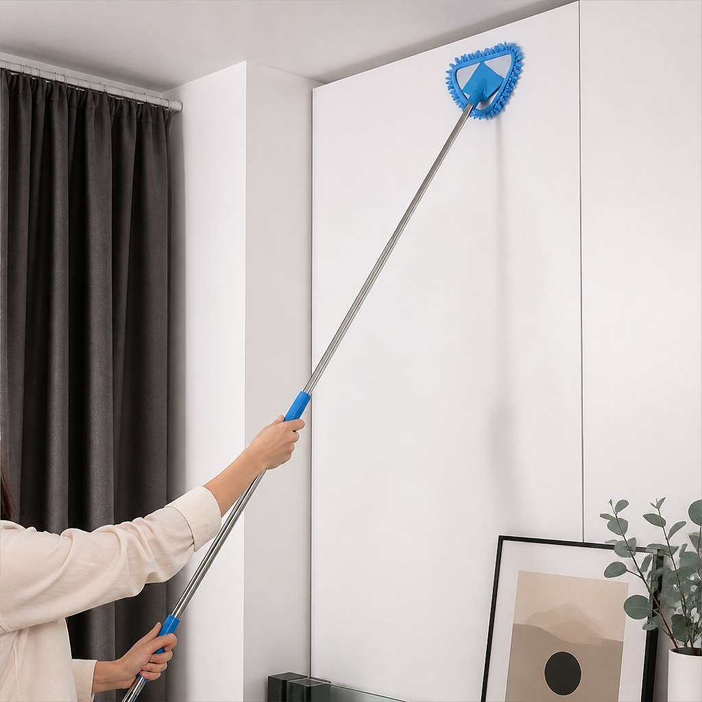 Person using blue triangle extendable wall cleaning mop on high wall