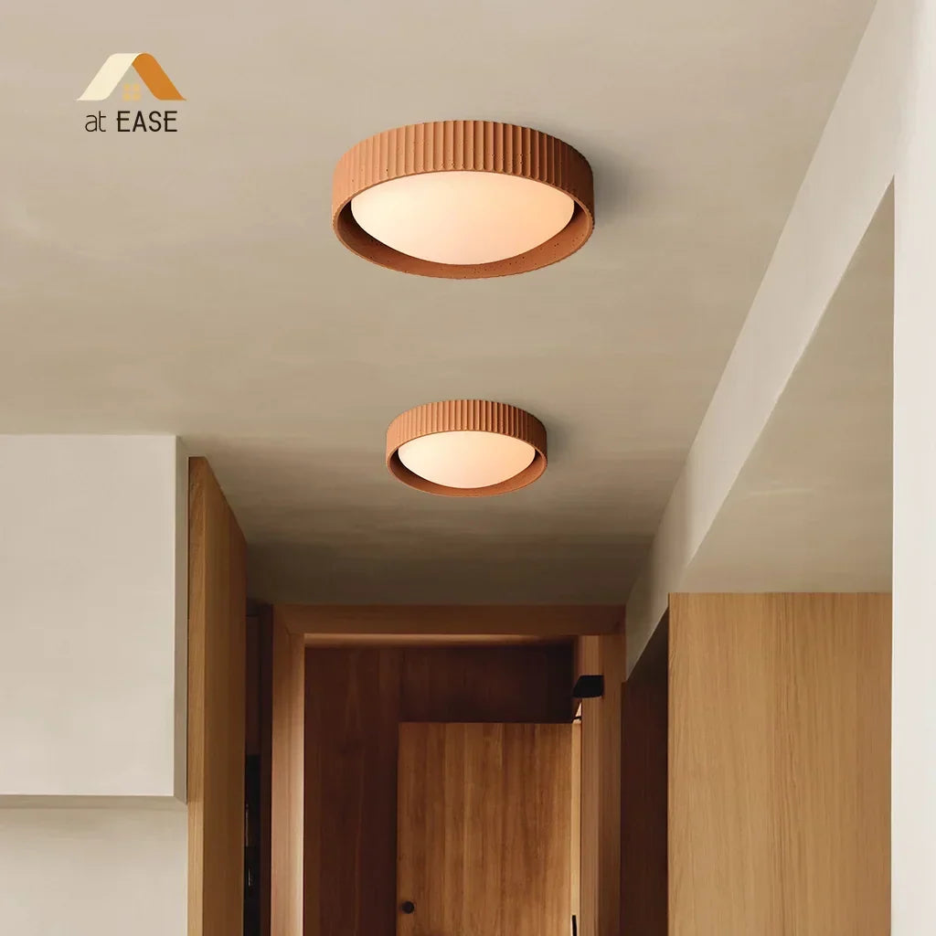 Neutral-toned concrete lamp blending into a modern minimalist hallway decor