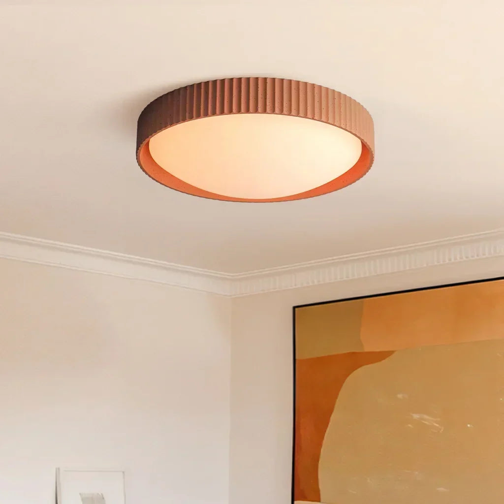 Stylish interior featuring the grey concrete flush mount light fixture