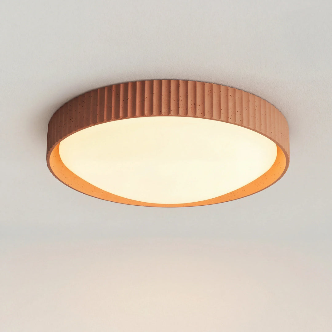 Close-up of the grey concrete texture on the flush mount ceiling light fixture
