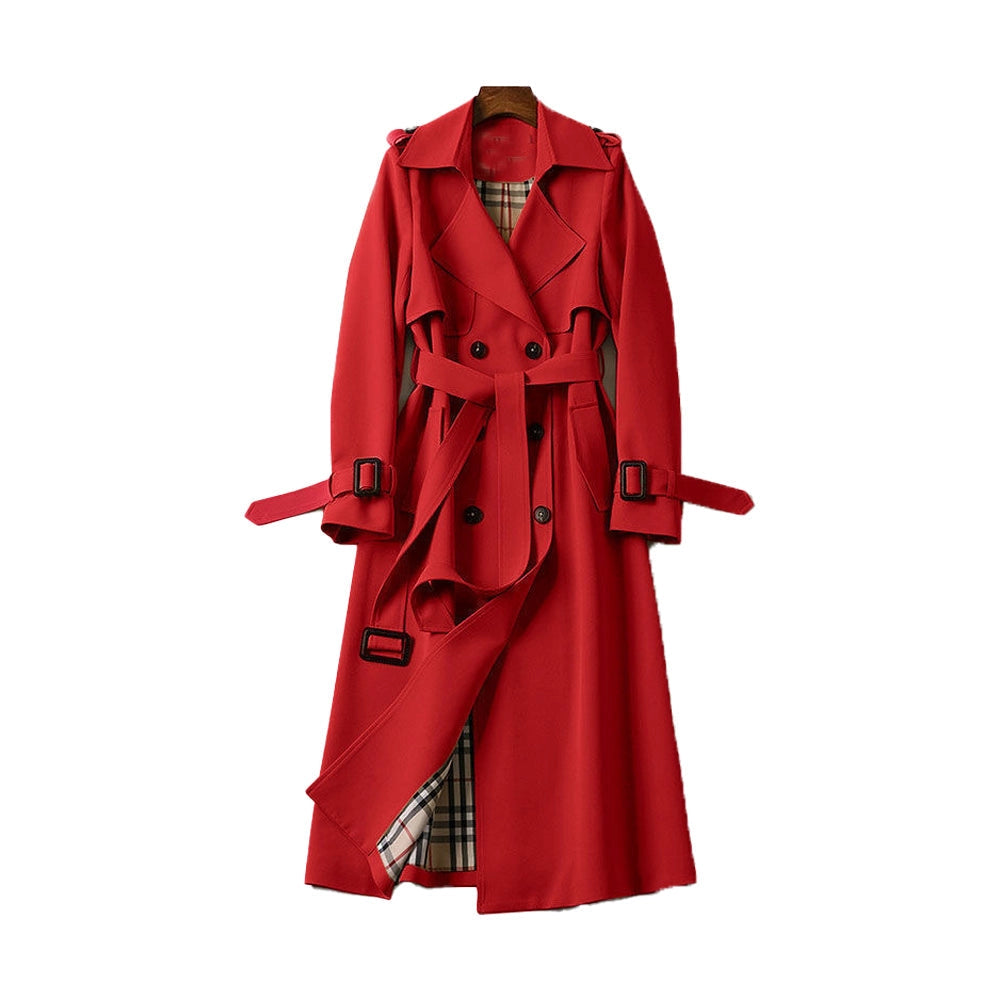 Detailed view of fabric tie belt and deep pockets on classic coat