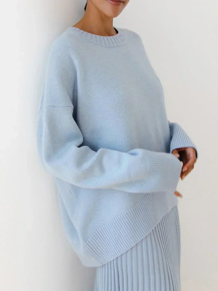 Model wearing light blue relaxed fit oversized sweater