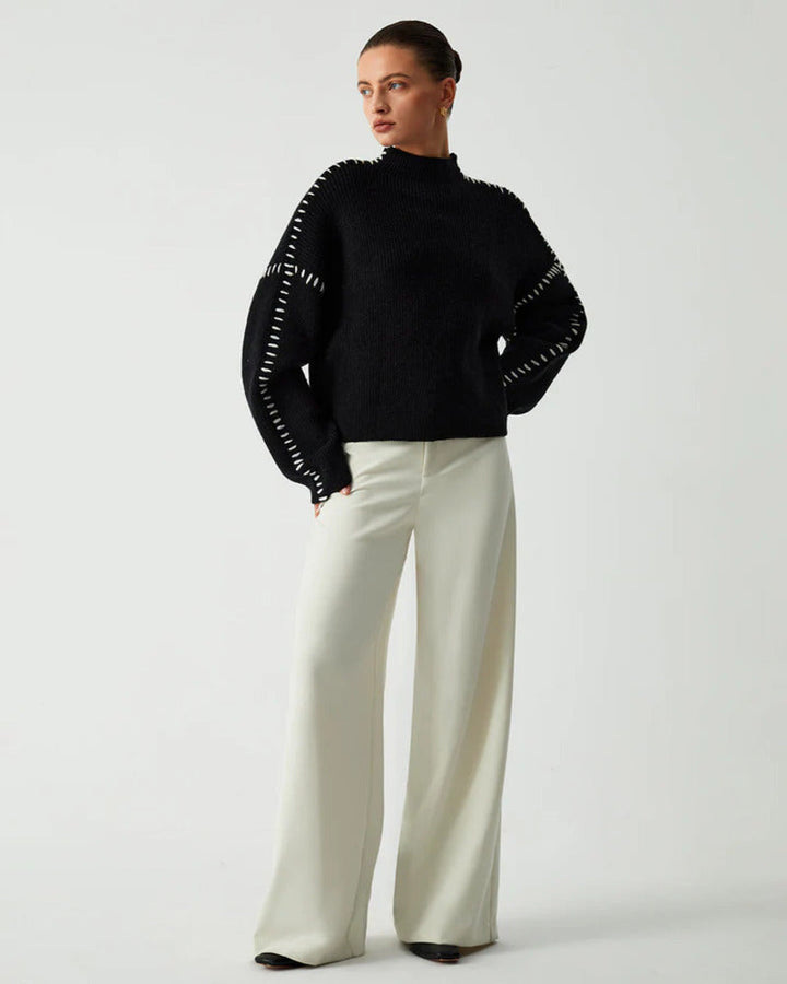 Side profile of casual black knitwear mock neck top for autumn style
