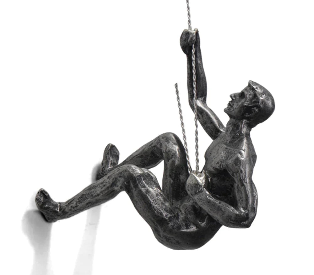 Side angle view of the climbing wall sculpture showing detailed posture