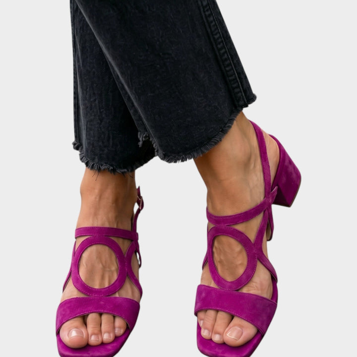 Women wearing purple block heel strappy sandals with cropped dark jeans