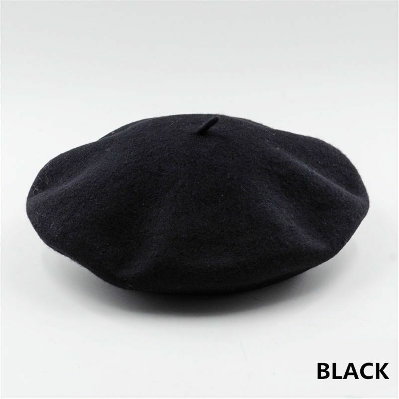 Black classic women's winter beret on a clean white background