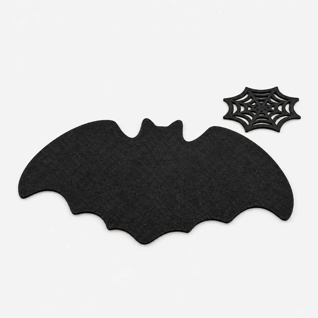 Close up of gothic bat table mat showing textured material and spooky holiday decor details
