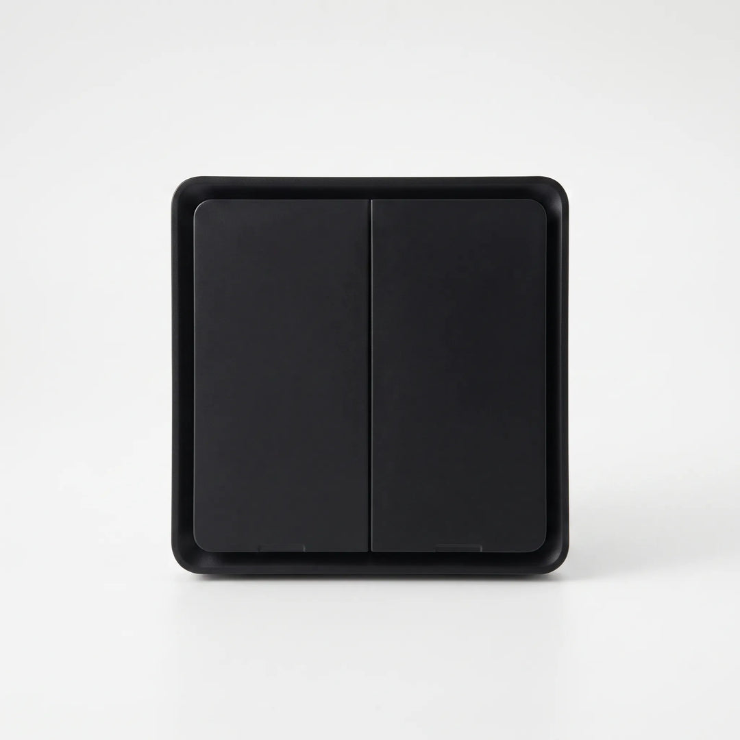 Wireless remote smart wall switch mounted on living room wall