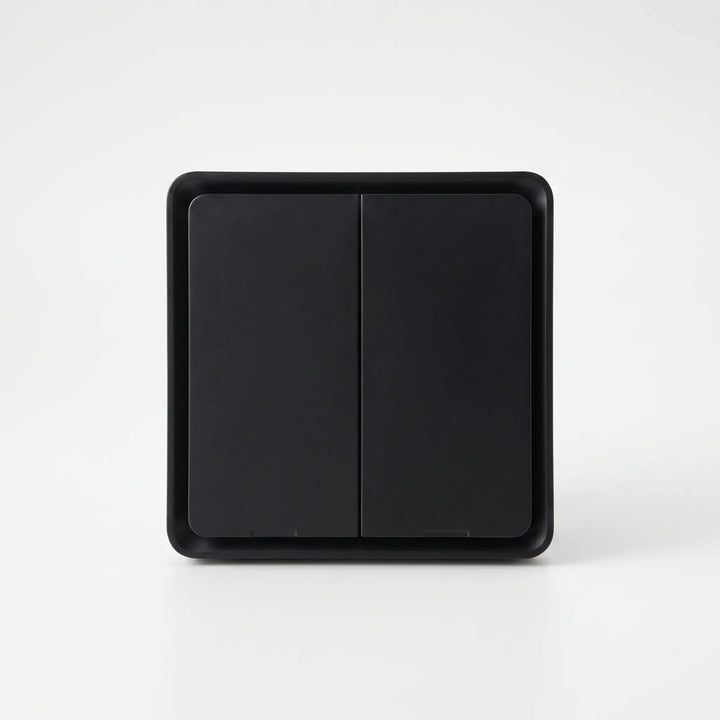 Wireless remote smart wall switch mounted on living room wall