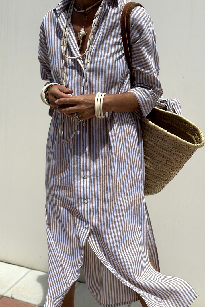 Model wearing casual striped midi dress, ideal vacation outfit for women