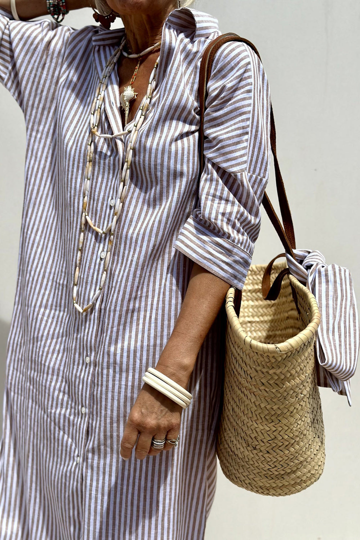Detail of collar and button placket on women's striped summer midi dress