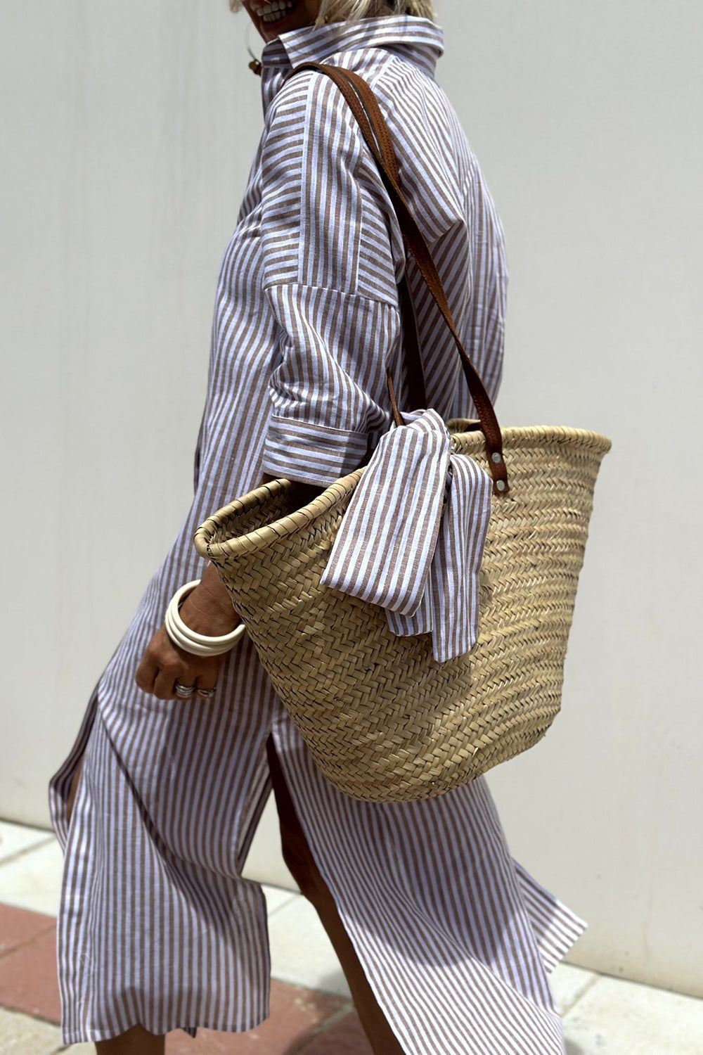 Full length of women's fashion striped button-down midi dress styled for casual wear