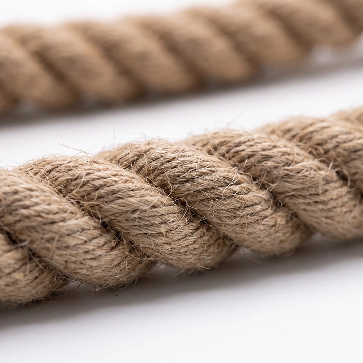 Close-up of the textured natural braided fiber structure of the bird rope