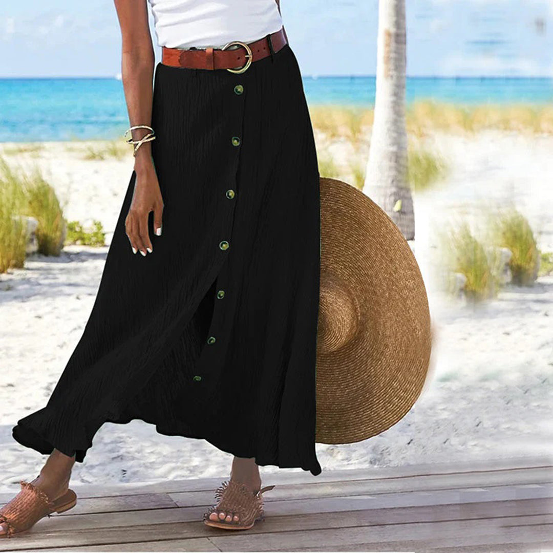 Woman wearing black A-line button midi skirt outdoors