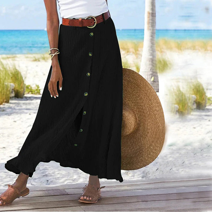 Woman wearing black A-line button midi skirt outdoors