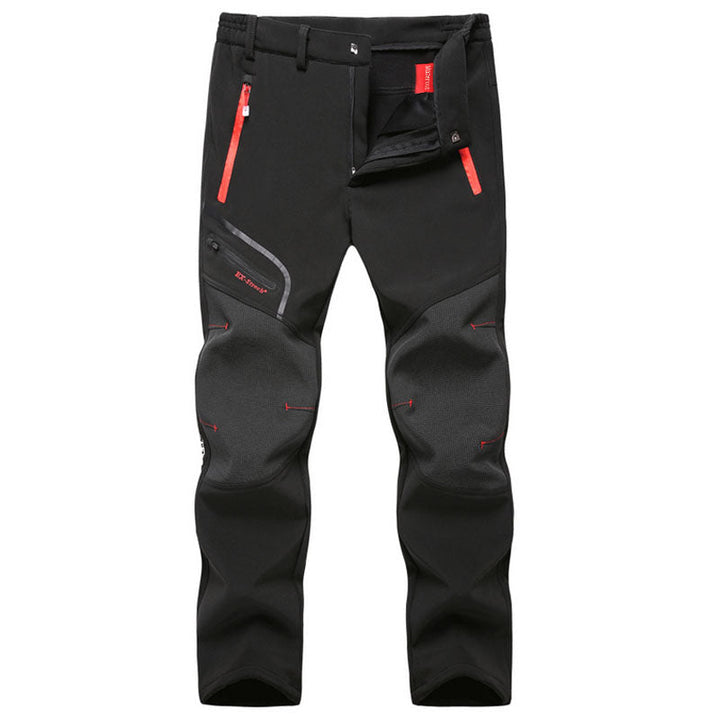 Close-up of black men's winter lined waterproof trousers featuring zippered pockets and ergonomic knee panels.