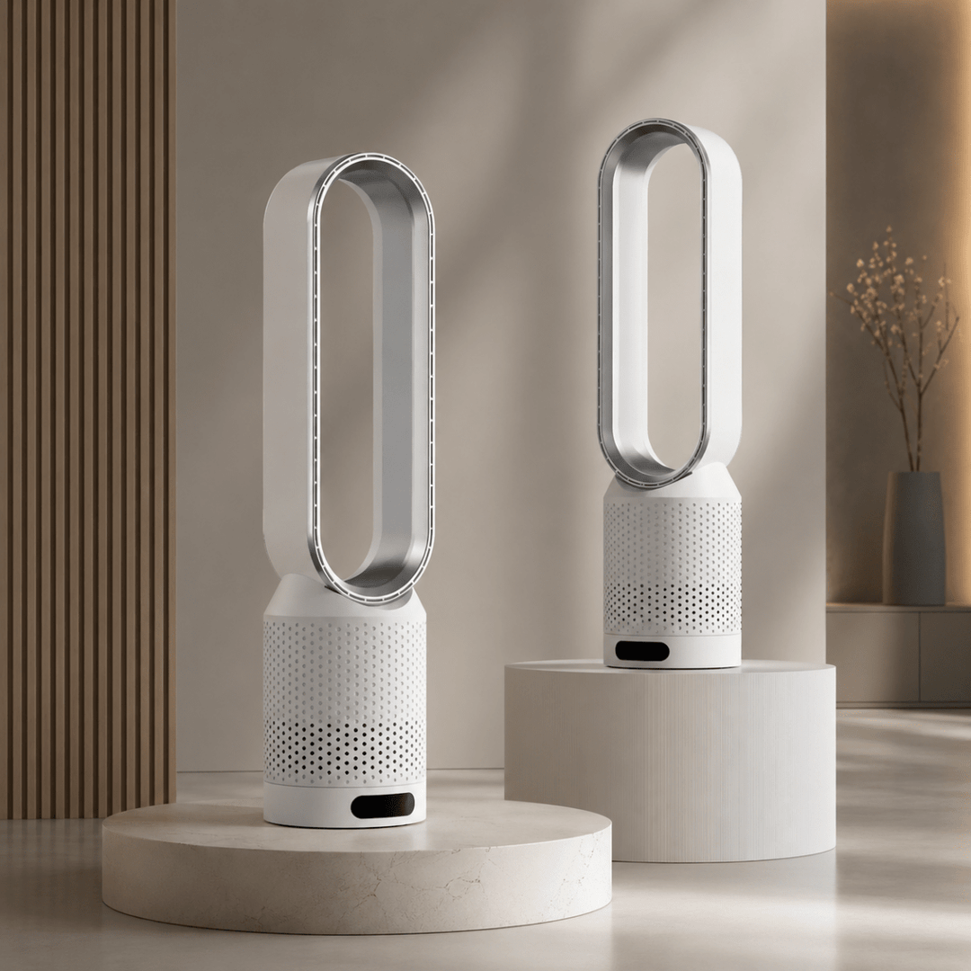 Two white bladeless tower fans with metallic accents showcased on display pedestals.