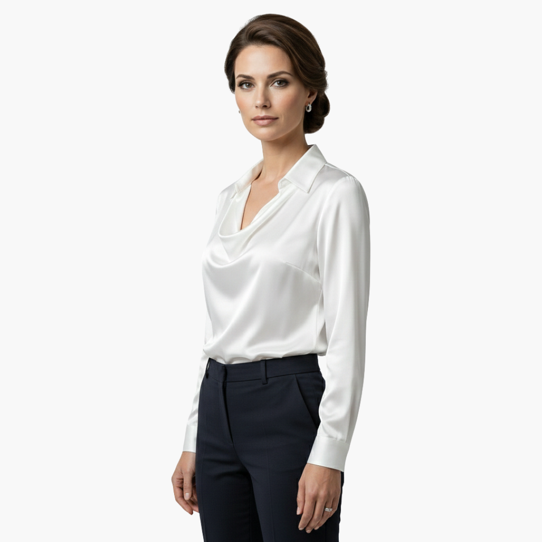 Side profile view of the elegant white long sleeve blouse on a model