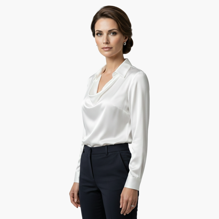 Side profile view of the elegant white long sleeve blouse on a model