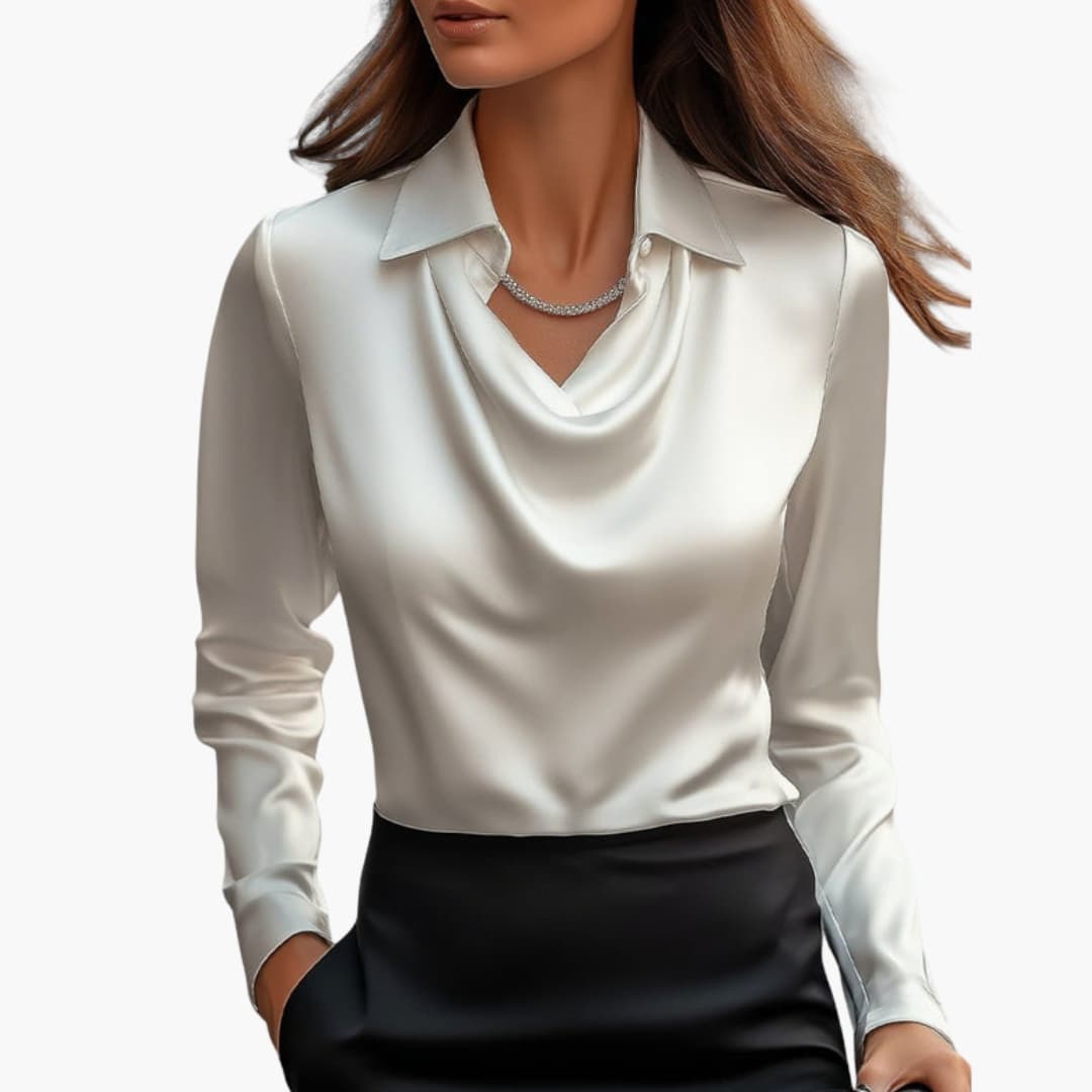 Model wearing a white draped neck long sleeve blouse paired with black trousers