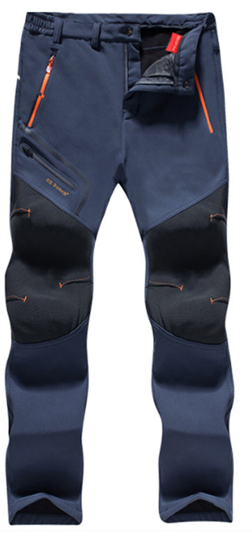 Close-up of blue men's winter lined waterproof trousers showing high-visibility zipper details and flexible construction.