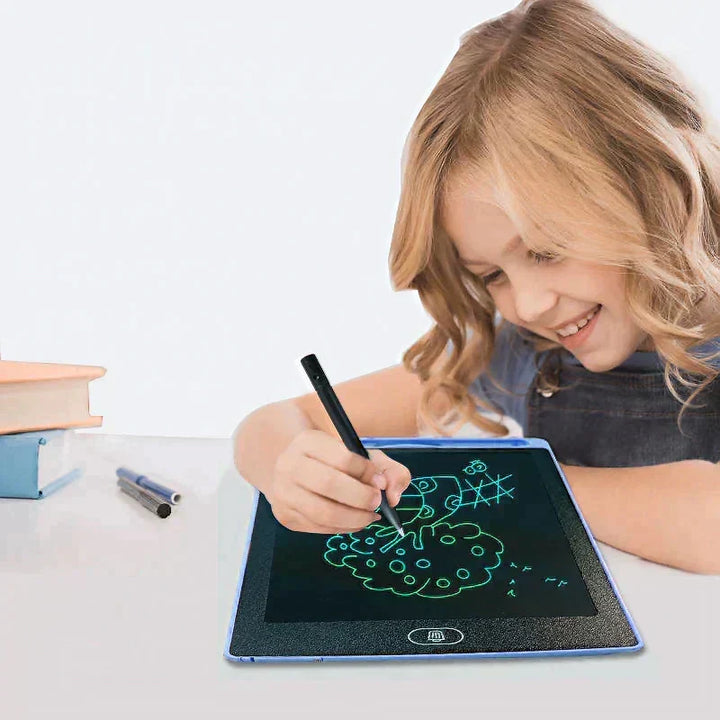 Young girl drawing colourful doodles on a blue LCD writing tablet at a desk