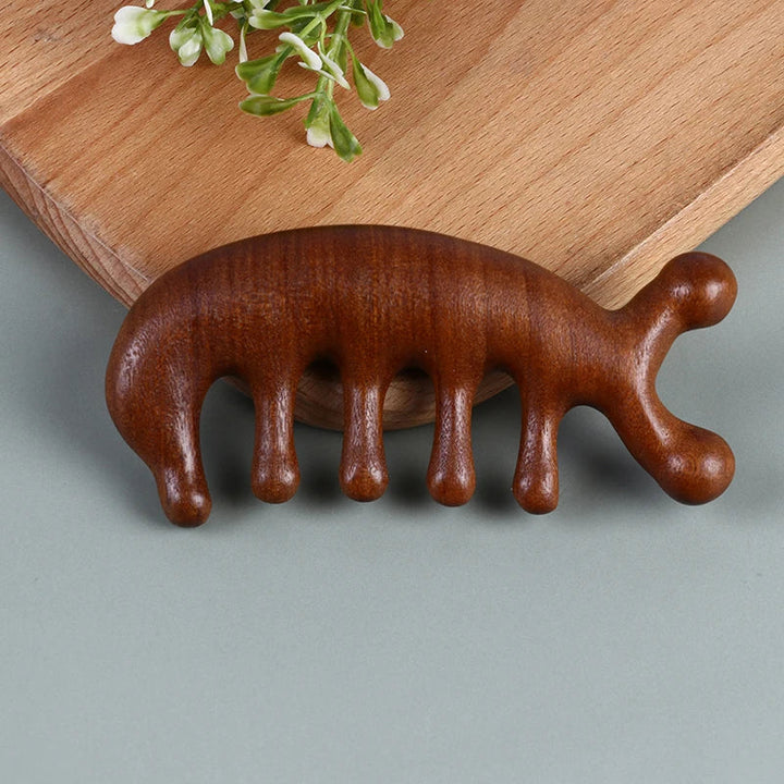 Front profile view of the ergonomic sandalwood massage comb