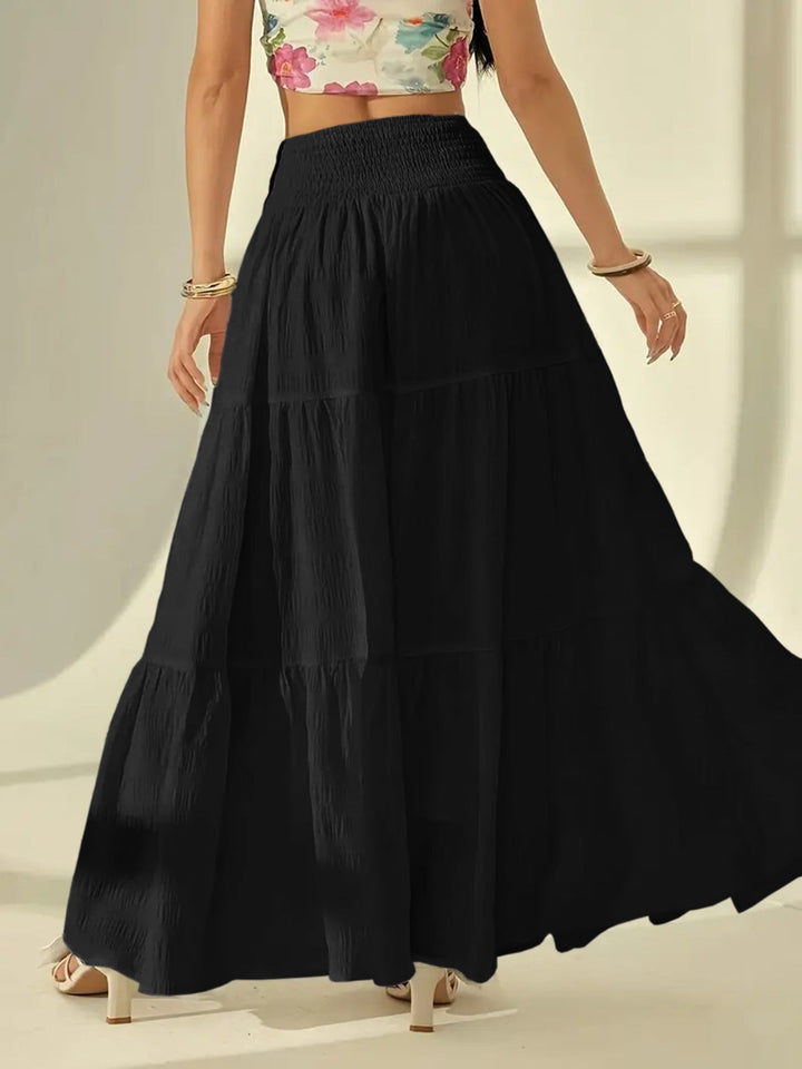 Flowy boho maxi skirt in a high waist tiered design, ideal summer fashion for women.