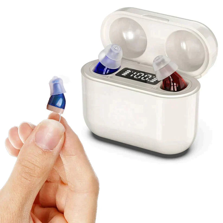 Rechargeable hearing aids displayed with their portable charging case and extra tips