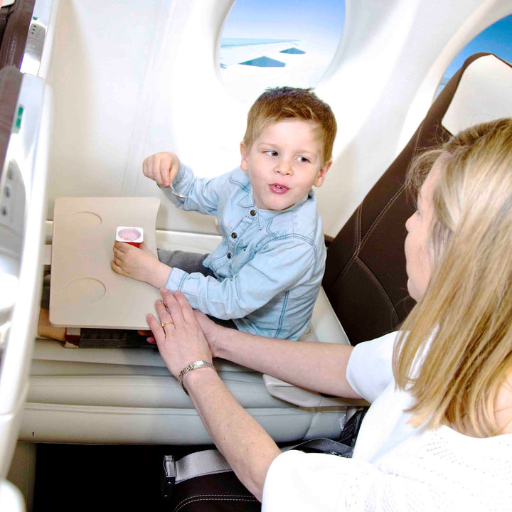 Compact inflatable kids airplane bed folded in a carry bag