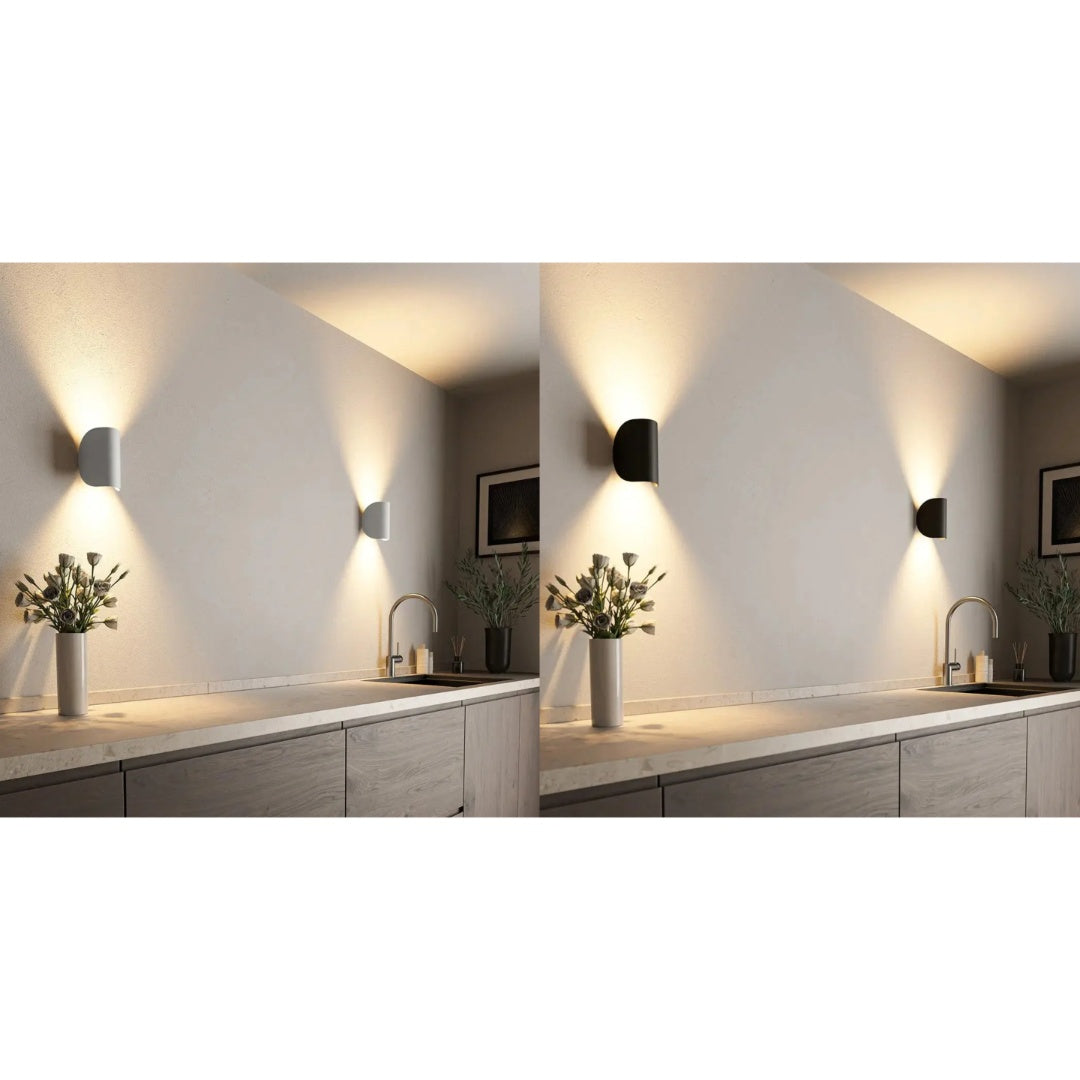 Side-by-side comparison of white and black modern LED wall lamps installed on a wall