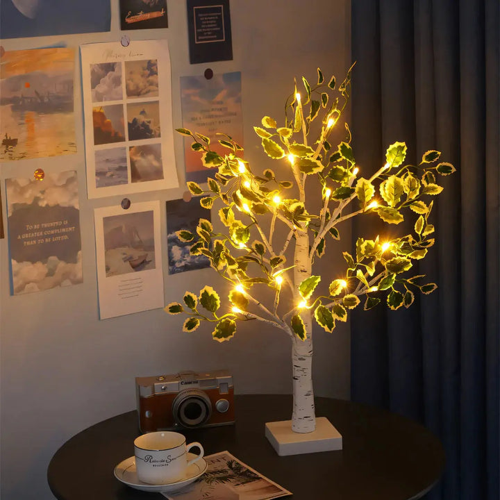 Glowing tree table lamp emitting a cozy ambiance next to a coffee cup