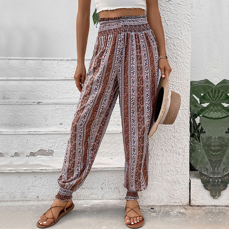 Woman wearing printed lantern trousers with elastic waist and gathered ankles