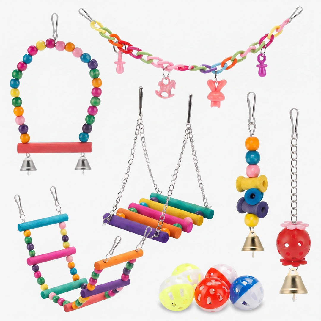 Collection of colourful wooden bird toys including swings, ladders, and bells on a white background